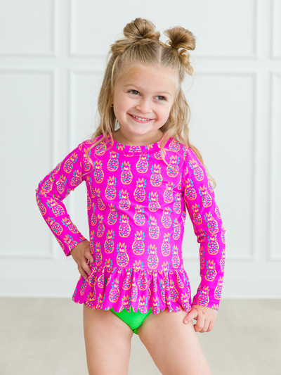 RuffleButts + RuggedButts - Girls Neon Violet Pineapples Scalloped Long Sleeve Rash Guard 2-Piece
