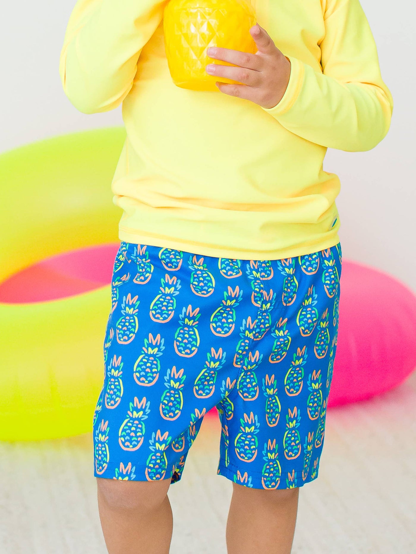 RuffleButts + RuggedButts - Boys Neon Blue Pineapples Swim Trunks (Run Big)