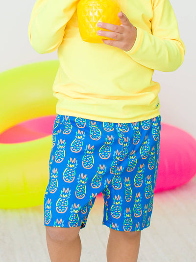 RuffleButts + RuggedButts - Boys Neon Blue Pineapples Swim Trunks (Run Big)